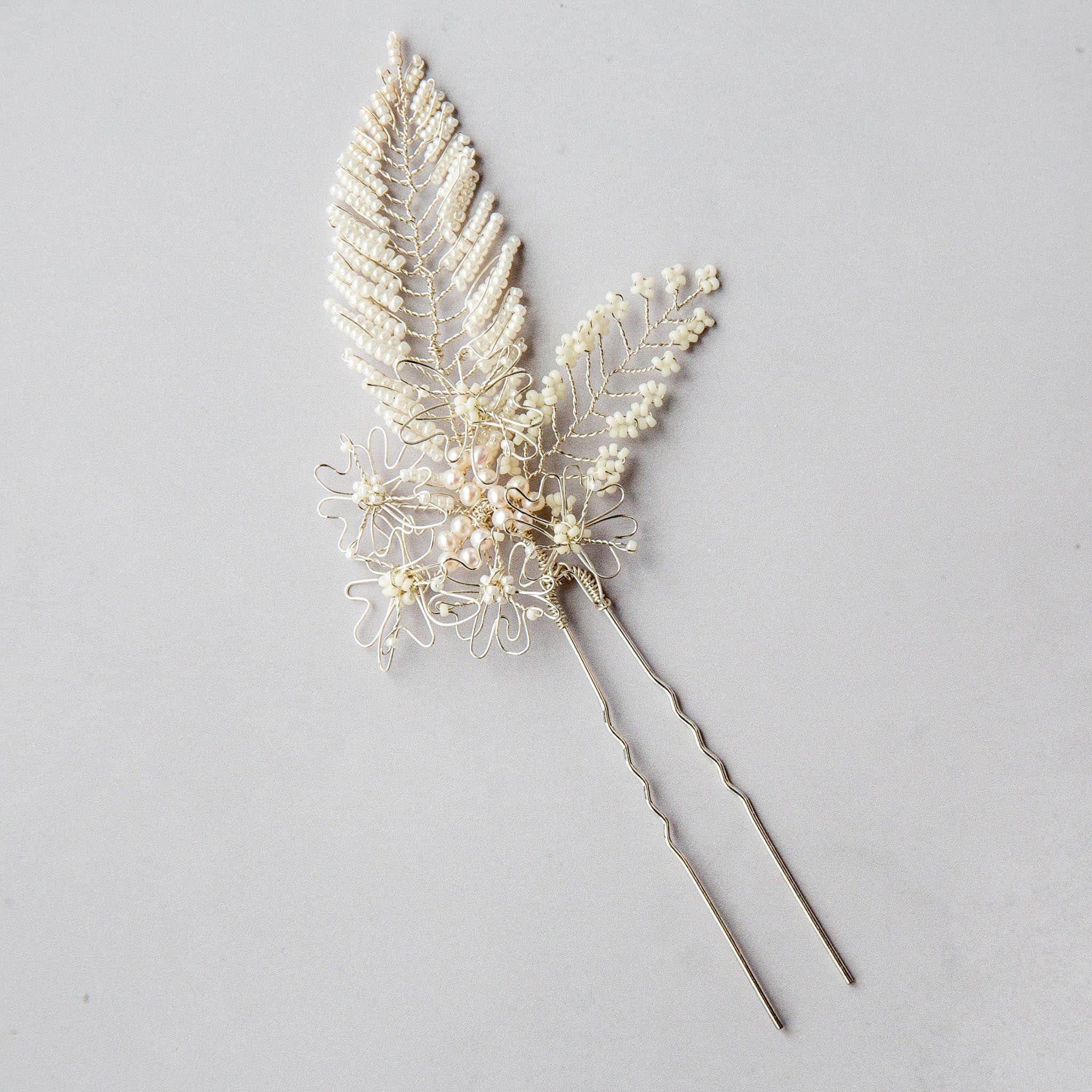 Bridal hair pin in silver and ivory with leaves and pearls by Judith Brown Bridal
