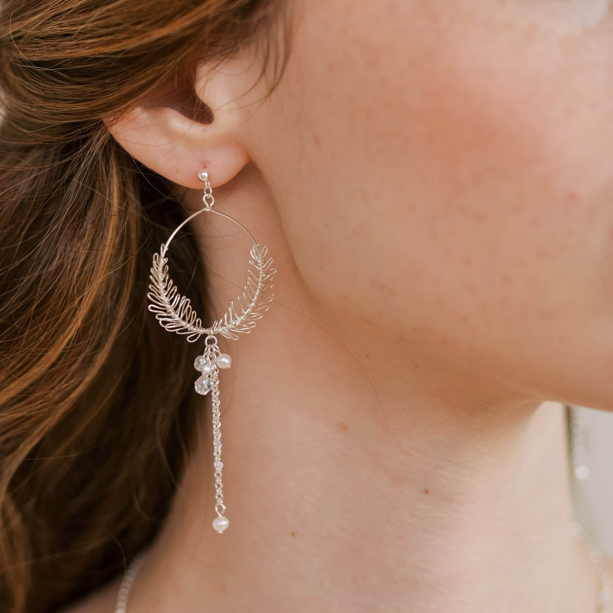 Colse up of the Cinzia wedding earrings in silver by Judith Brown Bridal