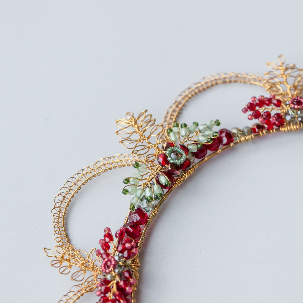Close up detail of the Oriana crown with handmade leaves and beaded flowers by Judith Brown Bridal