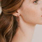 Handmade earrings in bronze wire with red and green beading by Judith Brown Bridal