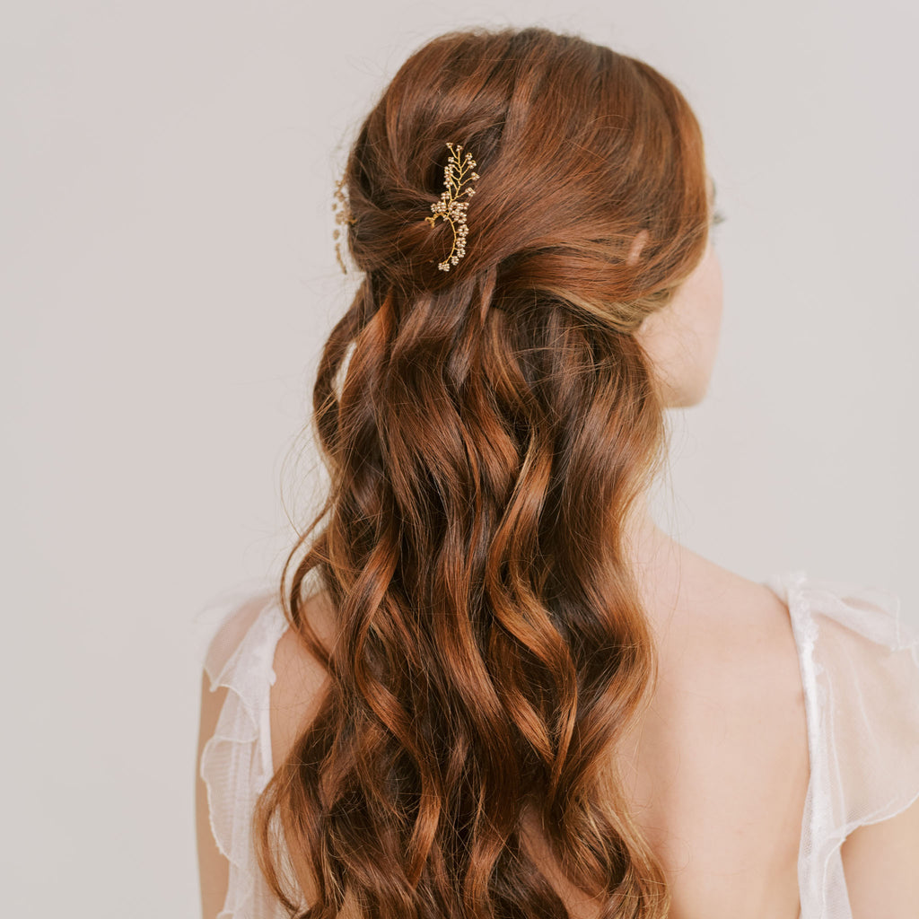Side view of Farfalla wedding hair pins in gold by Judith Brown Bridal