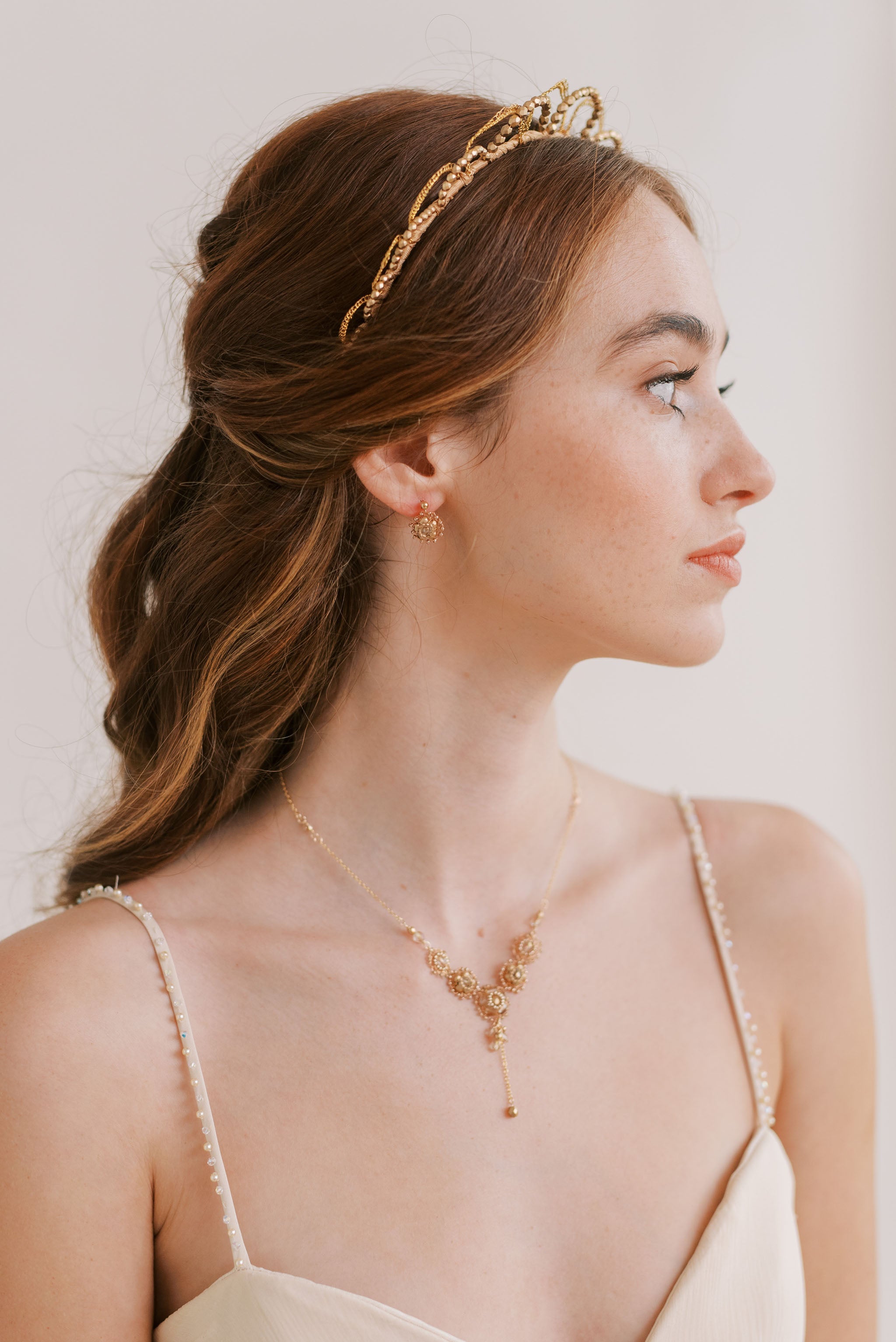 Coordinating accessories and jewellery in golden tones by Judith Brown Bridal