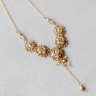 Intricate wedding necklace in golden beads and wire by Judith Brown Bridal