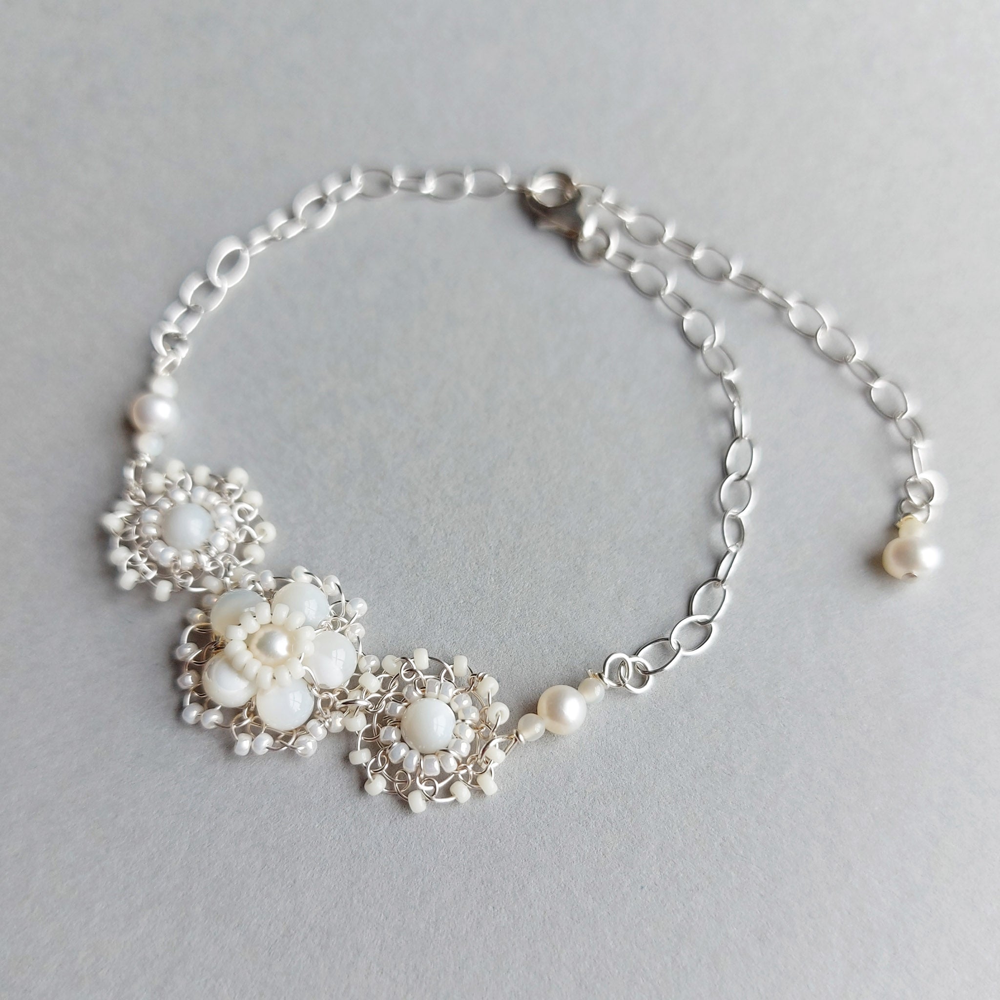 Silver wedding bracelet with pearls and mother of pearl, handmade by Judith Brown Bridal
