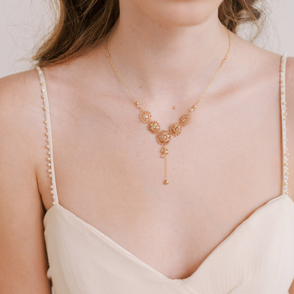 Wedding necklace with glass beads and wire in gold by Judith Brown Bridal