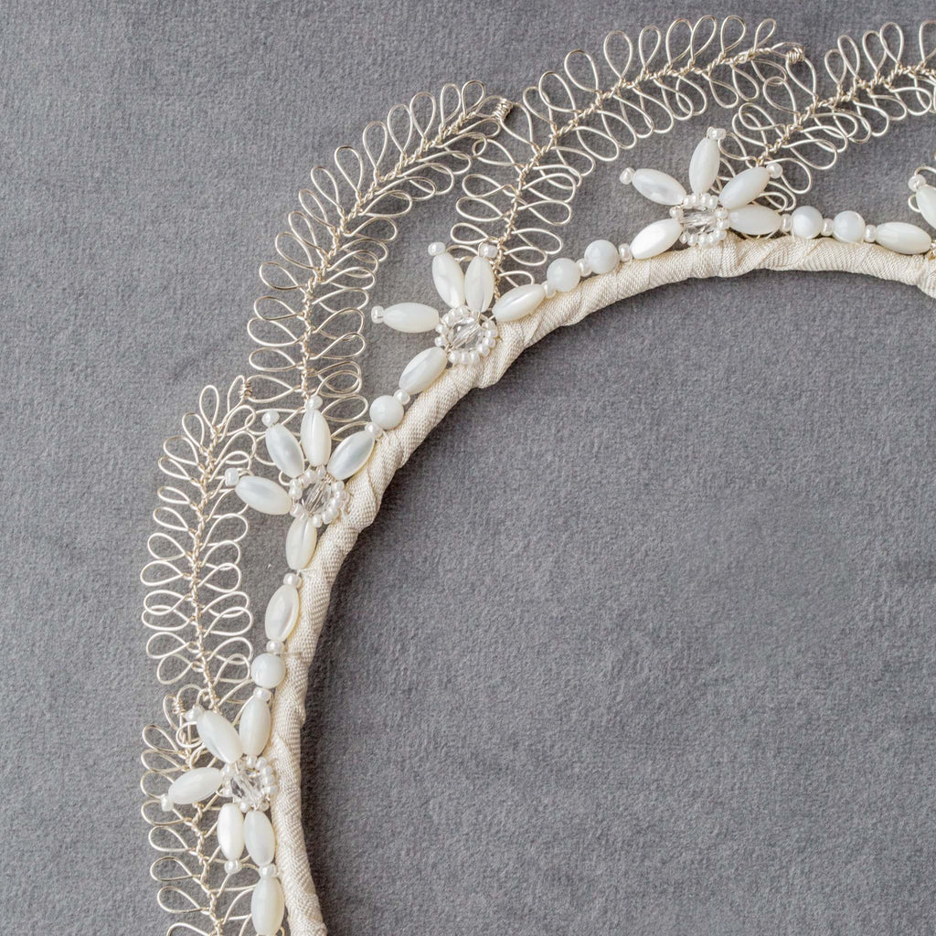 Colse up of the Lucia wedding crown by Judith Brown Bridal, handmade in silver with mother of pearl