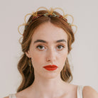 Handmade wedding headpiece in gold, red and green by Judith Brown Bridal