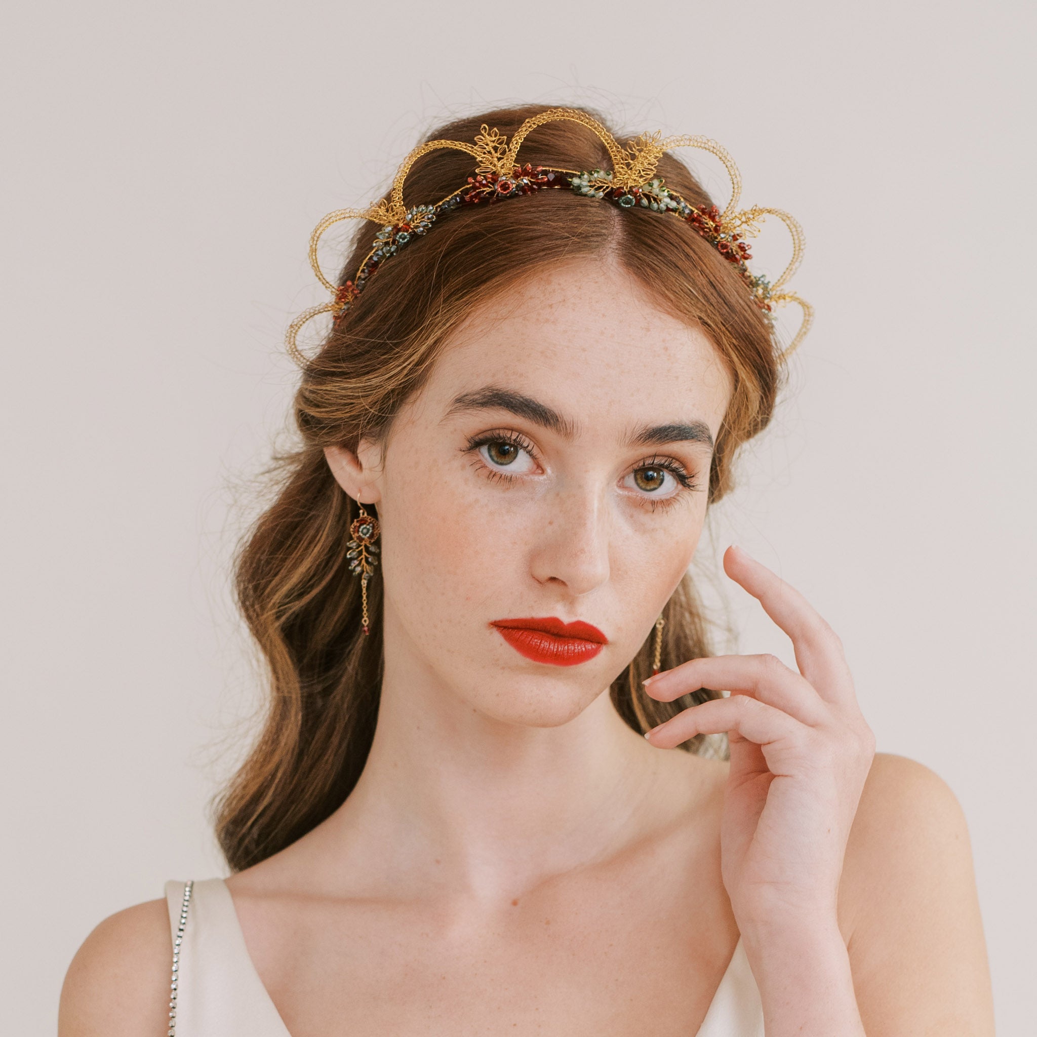 Statement bridal crown in gold, red and green with handmade flowers and beaded leaves by Judith Brown Bridal