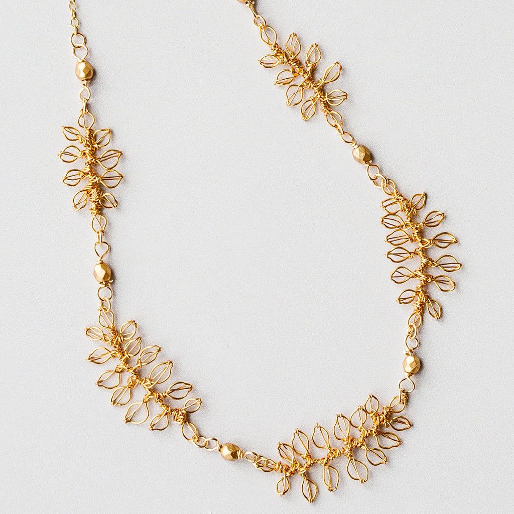 Close up image of the Ornella handmade wedding necklace with leaves by Judith Brown Bridal